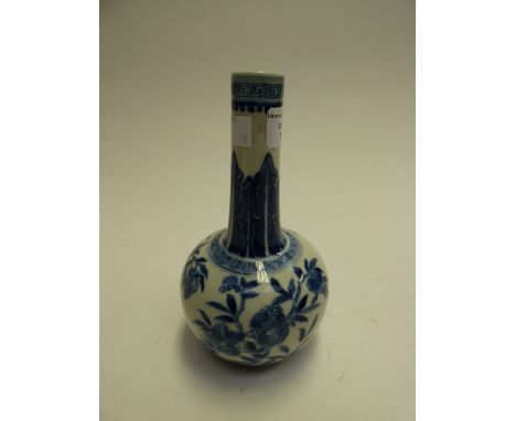 A Chinese blue and white bottle vase, late Qing dynasty, with pomegranate decoration, the base stamped with six imitation Xua