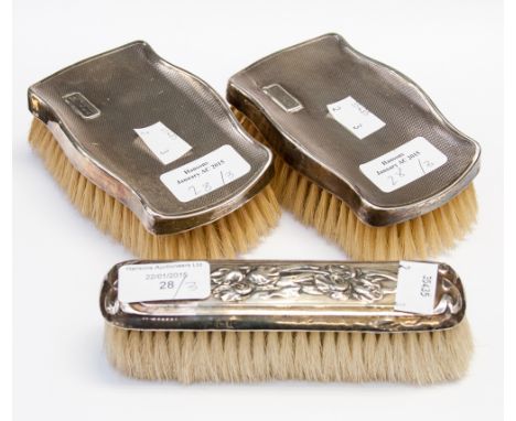 A pair of Birmingham silver (1941) backed (engine turned) gentleman's hair brushes together with a London 1901 silver backed 