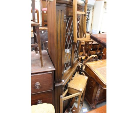 A 1930s oak stick stand with hinged compartment; together with three walking sticks, a child's chair, an oak cased aneroid ba