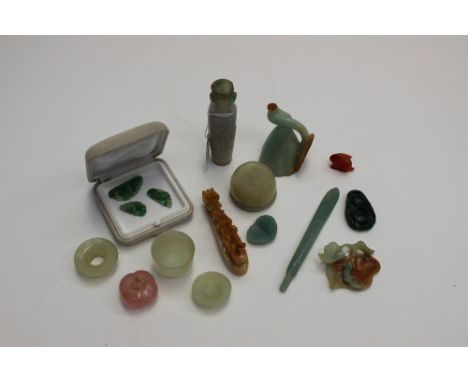 A collection of assorted Chinese jade items, some possibly 19th century, of varying colours, mostly carved