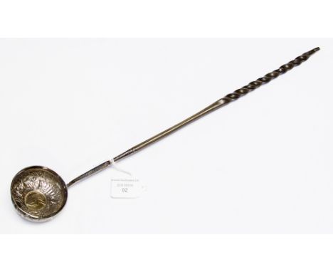 A George III white metal punch ladle, with a barley twist whale bone handle and later inset with a George II 1758 coin