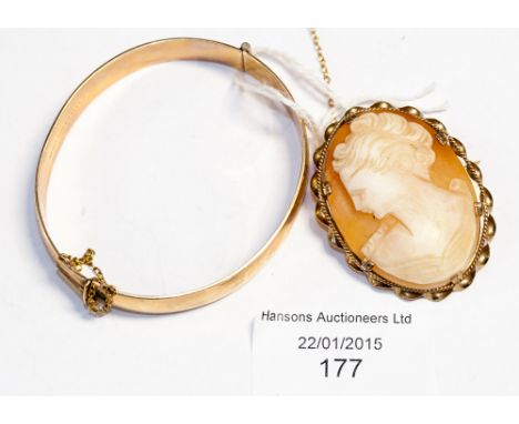 A 9ct gold mounted cameo, carved with a portrait of a lady; together with a gold plated bangle (2) 