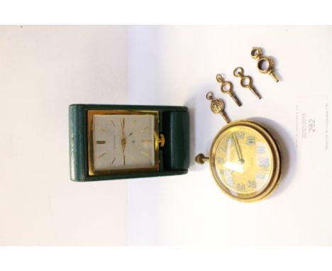 A 1930s Jaeger le-coultre gilt metal cased travelling clock, with silvered dial, baton numerals and date aperture in dark gre