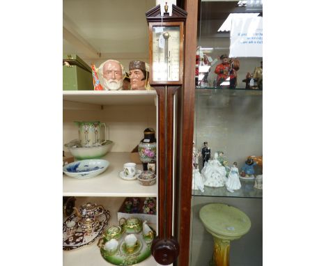 An Edwardian stick barometer, A. Comitti and Son, London, mahogany with satinwood inlay 