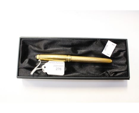 A Mont blanc fountain pen, the gold plated barrel with engine turned decoration, fitted with an 18ct gold nib, the cap inscri