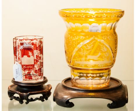 A Bohemian yellow flashed vase, acid etched, with deer in landscape on hardwood stand, together with a Bohemian octagonal tum