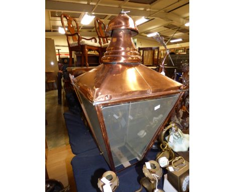 A large copper and glass hanging lantern
