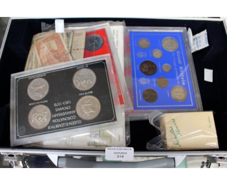 Lockable metal coin case containing commemorative sets, commemorative coins, some first day covers and other oddments  