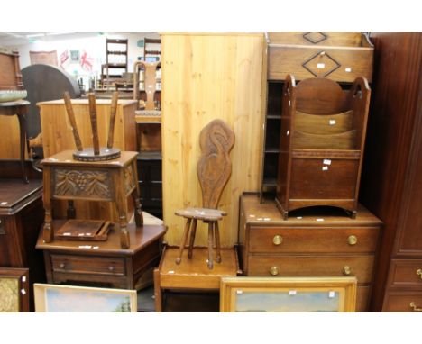 A mixed collection of dark oak furniture, comprising of mid 20th Century chest of drawers, book stand, magazine stand, tea tr