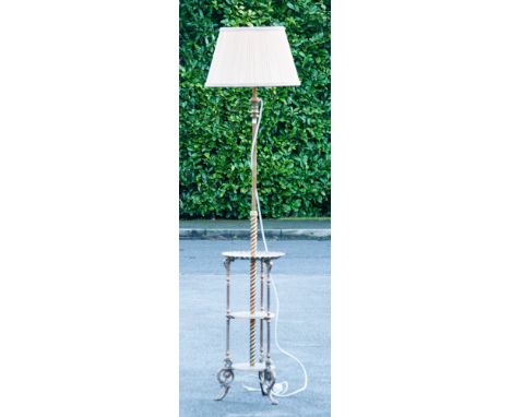 A late 19th or early 20th century cast brass and copper standard lamp with three tier base, adjustable