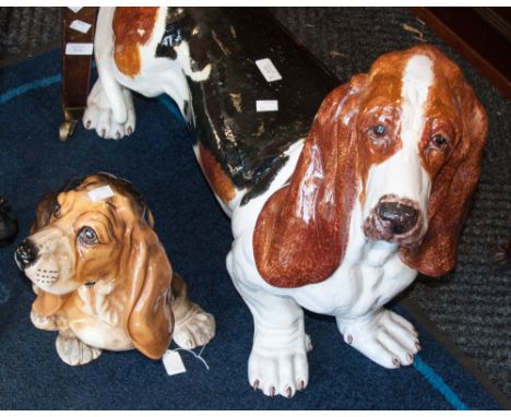 A collection of Italian ceramic figures of Bassett hounds, various sizes and glazes