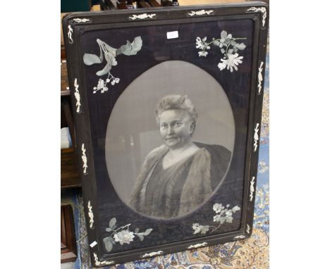 An Oriental ebony and bone inset silk frame depicting a woven silk half length portrait of a lady
