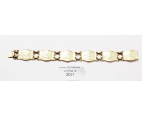 A Norwegian silver and enamel bracelet with six panels depicting Norwegian scenes