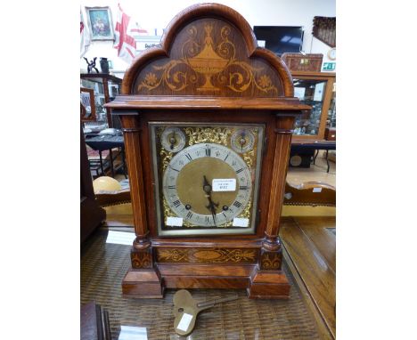A 19th Century figured walnut and rosewood mantle clock, bracket form with inlaid decoration, German movement, two subsidiary