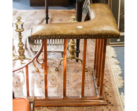 An Arts and Crafts style copper and leather mounted studded fireside surround, 161cm wide, 47cm deep
