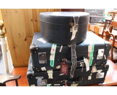 Two 1950s style suitcases with original travel labels and one 1940s hat box with two new hats in navy (5) 