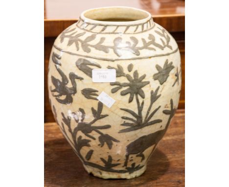 A Persian style slipware vase, ovoid form, grey slip decoration of birds and foliage over cream glaze