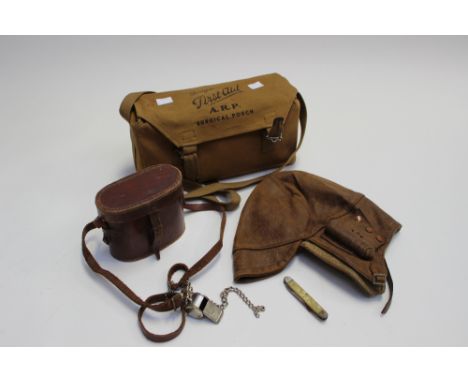 A leather helmet car/motorcycle 1930s ARP First Aid surgical pouch, acme whistle and a binocular box (4) 