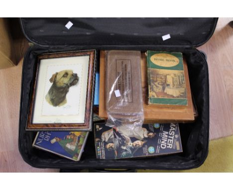 Books and camera, along with binoculars, box and suitcase 
