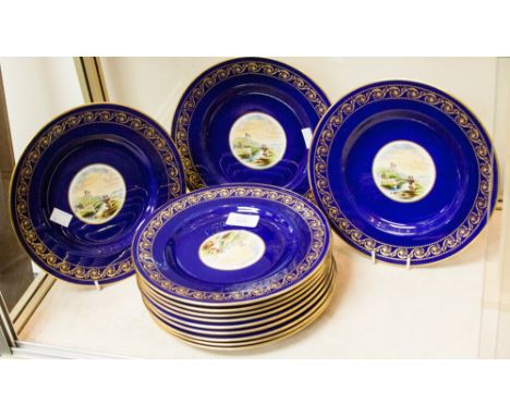 A set of Spode Copeland dessert plates, cobalt blue with gilt border and landscape decorated centres, made for Davis Collamor