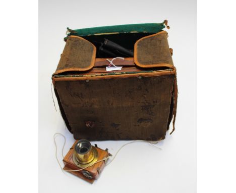 A vintage cased plate camera with bellows, circa 1900 with glass slides, one case stamped J. Lizars Glasgow 