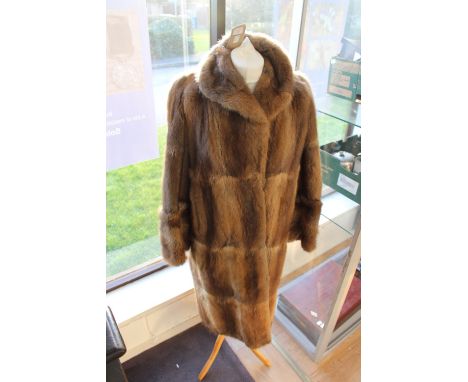 One 1950s Musquash full length coat (slight wear on the cuffs) otherwise good coat (1) 