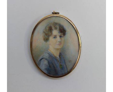 A portrait miniature of a lady, blue eyes, signed LM 