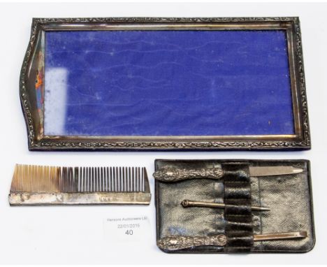 A late Victorian/Edwardian silver photo frame, together with silver comb, and manicure set in leather case
