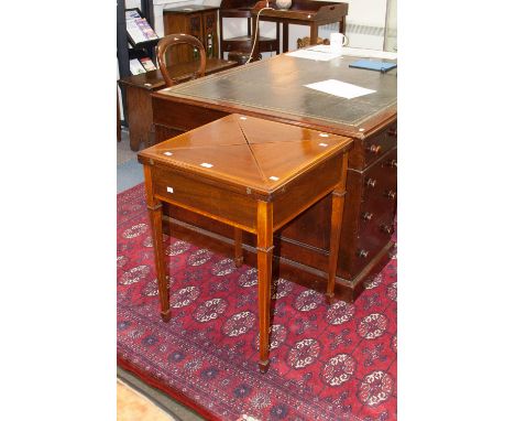 An Edwardian mahogany envelope card table, with satinwood cross-banding to edges, fitted with a single drawer, raised on squa