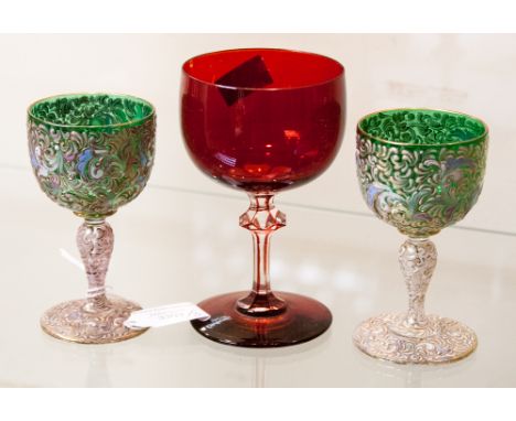 A pair of green tinted Bohemian opaque overlay goblets, early 20th century, together with a flashed ruby overlay goblet (3)

