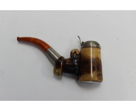 An Austrian pipe modelled as a hand clutching the bowl with white metal mounts, circa 1900 