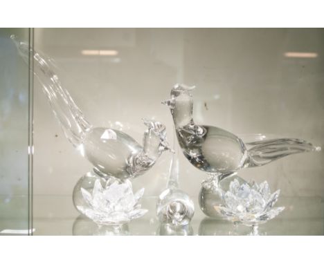 A pair of Swedish glass fanciful birds on bulbous bases, together with another Swedish glass bird table ornament, and two Swa