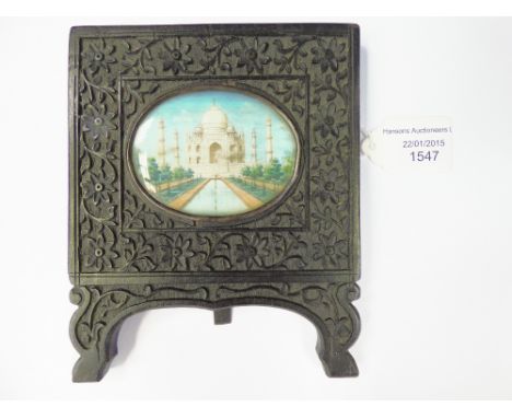 An oval miniature depicting Taj Mahal on ivory in ebonised frame, easel back
