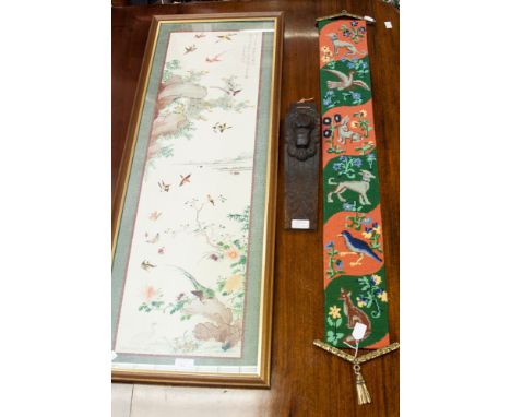 A carved oak lion mask wall hanging, together with hound and bird woolwork hanging, and a Japanese photo print (3)
