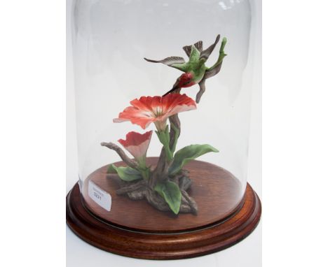 Ceramic figure of a bird and flowers under a glass dome (1)