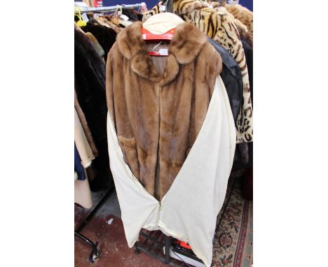 A three quarter length Mink coat in cover 