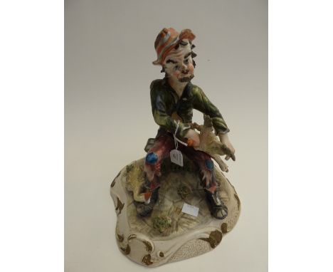 A Continental ceramic figure of a tramp 