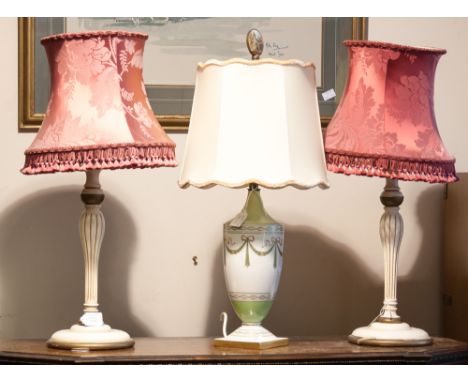 An Italian porcelain table lamp, together with two painted white wood table lamps with shades (3)
