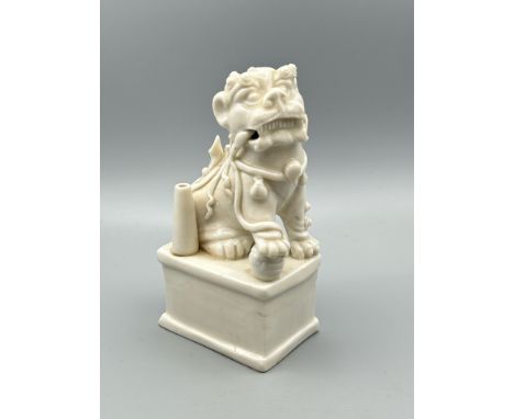 A Chinese Kangxi period Blanc de Chine Dog of Fu or Buddhistic Lion joss stick holder, 13cm high / AN17