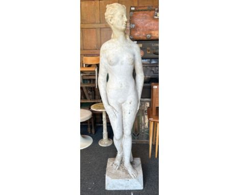 A stone possibly marble statue of a female nude, signed at the base, 152cm high, base 34cm wide / R