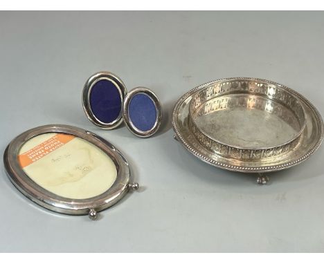 Two small hallmarked silver oval picture frames, largest 8cm high; another larger silver plate  oval picture frame (unmarked,