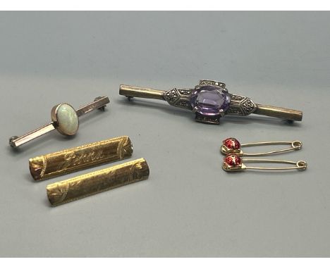 Six brooches; a pair of matching enamel ladybird safety pin brooches, length 3cm, stamped 375, gross weight (2) 1.2g; a  name