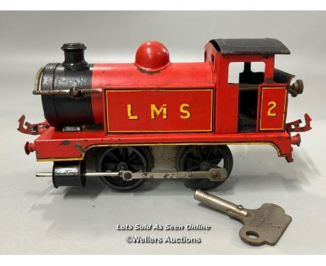 Vintage Meccano clockwork engine, red and black paintwork with key in working order, 17cm long (Lot subject to VAT) / T10