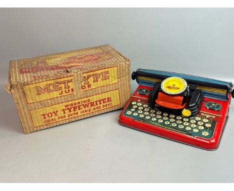 A Mettype Junior tinplate toy typewriter, c1950's in original box. Good condition / T10