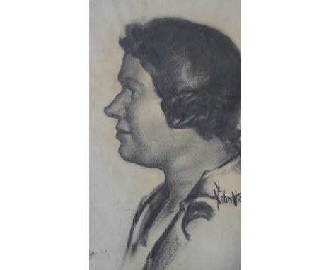A framed and glazed charcoal drawing, profile portrait, signed John Vickery. H.42.5 W.33cm 