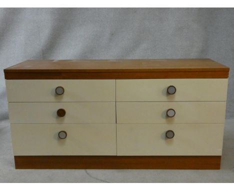 A 1960's vintage teak bank of six drawers with maker's label to the inside. H.69 W.138 D.45cm 