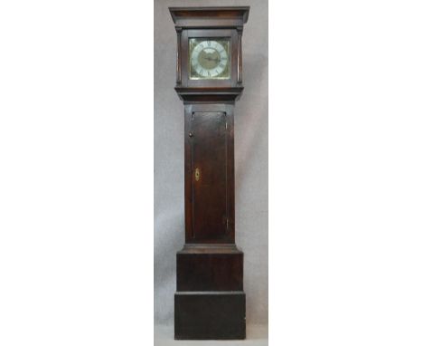 A Georgian oak cased longcase clock by Charles Snuggs of Farnham with silvered dial and pierced brass spandrels with weight a