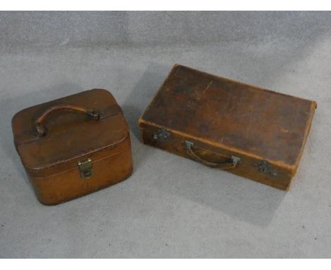 A vintage leather vanity case and a similar documents case. H.11 L.45 W.28cm 