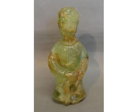 A Chinese Jade Carved Figure, 21cms tall 