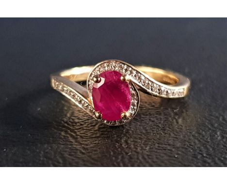 RUBY AND DIAMOND CROSSOVER RINGthe central oval cut ruby approximately 0.8cts, with diamonds to the surround and shoulders, o